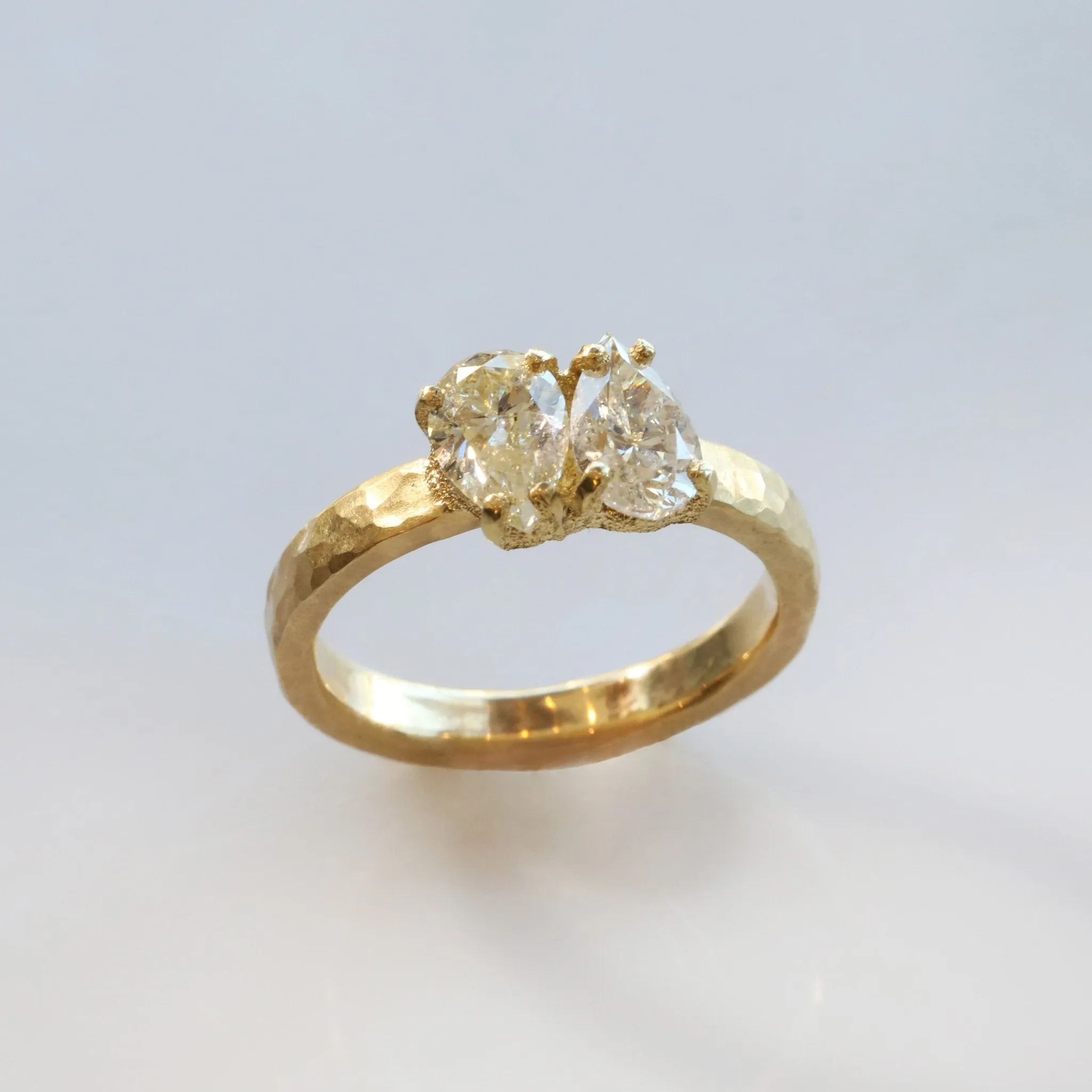 18 Karat Yellow Gold Hammered Band with Two Pear Shaped Diamonds